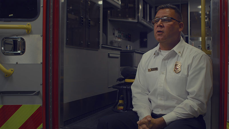 image from video of a first responder giving a testimonial about Medix ambulances